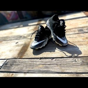 Like new white & black football cleats.